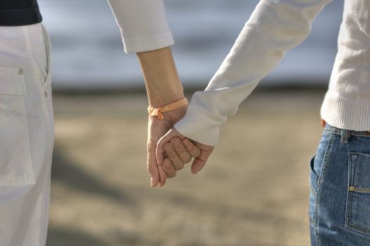 Couple holding each other hands