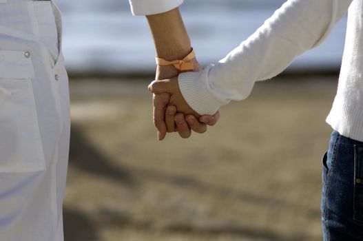 Couple holding each other hands