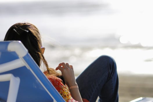 Woman relaxing on the beach