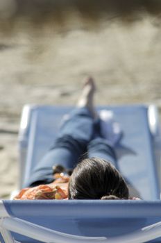 Woman relaxing on the beach