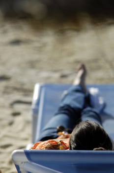 Woman relaxing on the beach