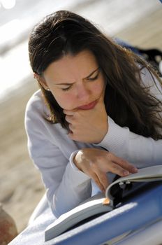 Woman reading on the beach