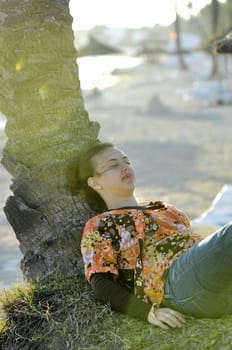 Woman relaxing on the beach