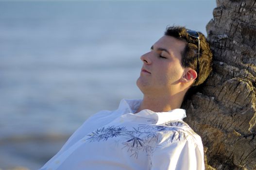 Man relaxing on the beach