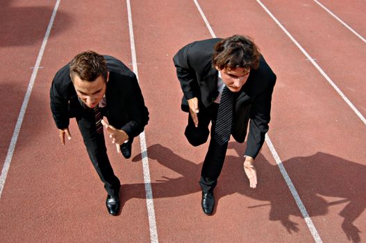 Man running on a track & field complex