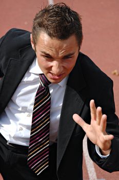 Man running on a track & field complex