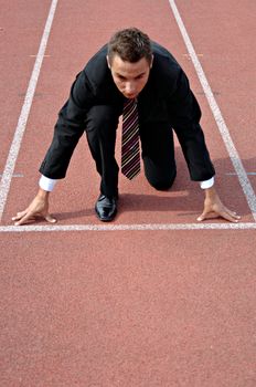 Man running on a track & field complex