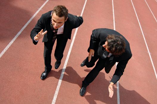 Man running on a track & field complex