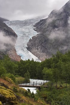 Bridge over the stream at Briksdal glacier - Jostedalsbreen national park, Norway