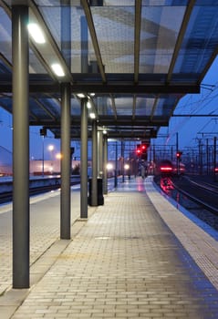 Train leaving the station in twilight (blured)