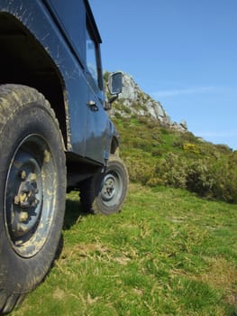 Off-road vehicle and a mountain in the background