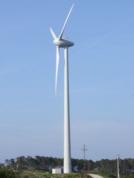 Wind power generator on blue sky