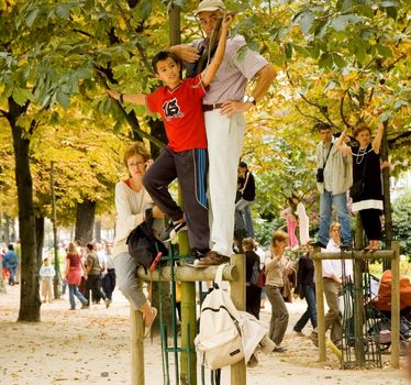 Spectators on trees. Breton Parade in Paris