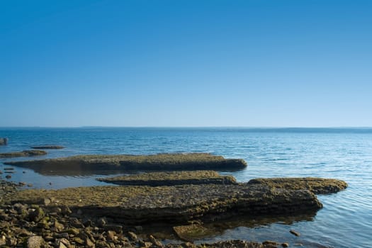 coastal landscape with rocks in the blue sea 