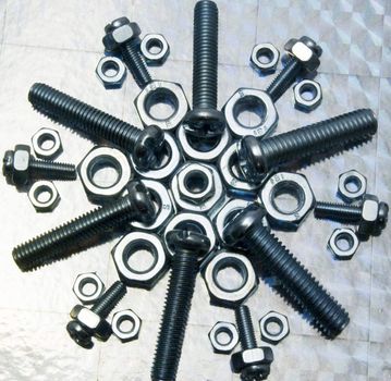 A pattern made from nuts,bolts,and screws