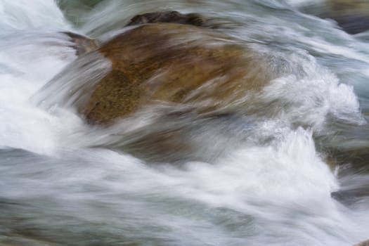 big stone in the stream 
