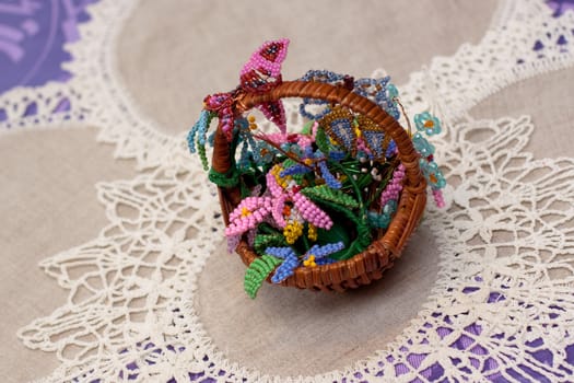 little crib with handmade flowers on white napkins
