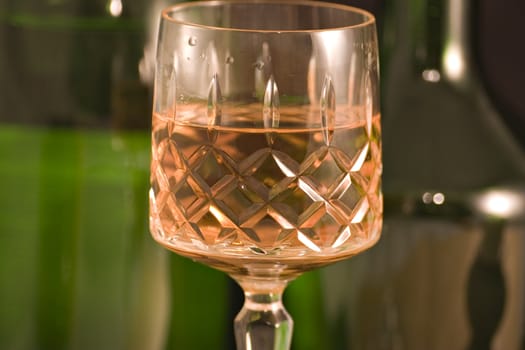 A cut glass containing whiskey or wine