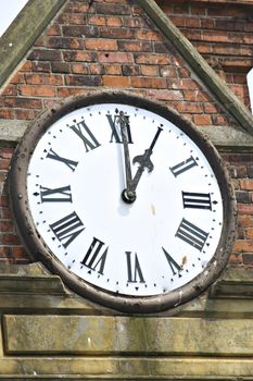 An old clock with a rusted frame