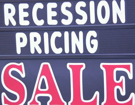 Recession pricing sale sign at a business establishment.