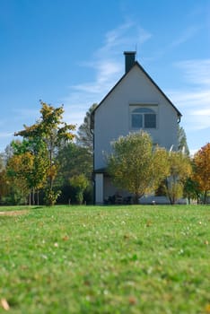 Country-side house in summer, grass, trees