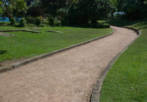 Sunny summer lonely park path