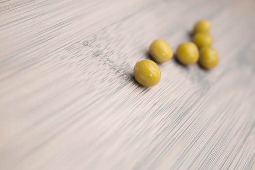 green peas on wooden background