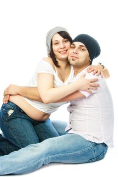 happy family, young pregnant woman and her husband embracing