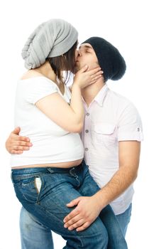 happy family, young pregnant woman and her husband kissing