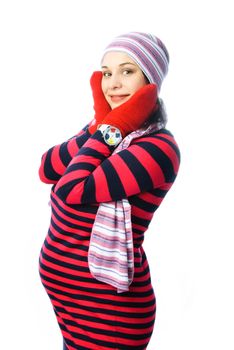 beautiful young pregnant woman wearing warm winter clothes against white background