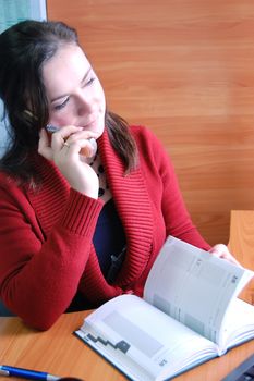 Office girl talking on phone, making appointment