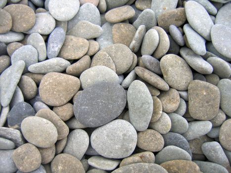 Pebbles on the beach as a background 
