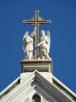 cross and figures on the roof of Santa Croce church in FlorenceTuscanyItalyneo-gothic facade