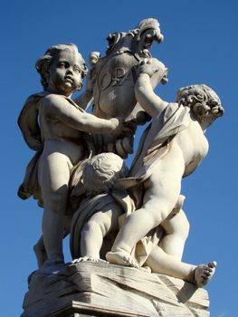 monument with angels holding herb of the city on Square of Miracles  in front of Leaning Tower in Pisa Tuscany Italy IX 2007