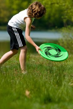 young beauty boy is getting his frisbee