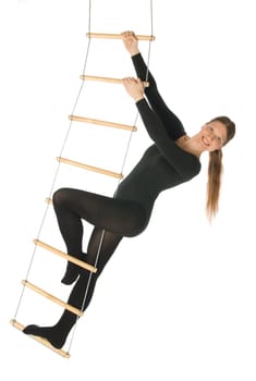 Isolated photo of a woman on a rope ladder