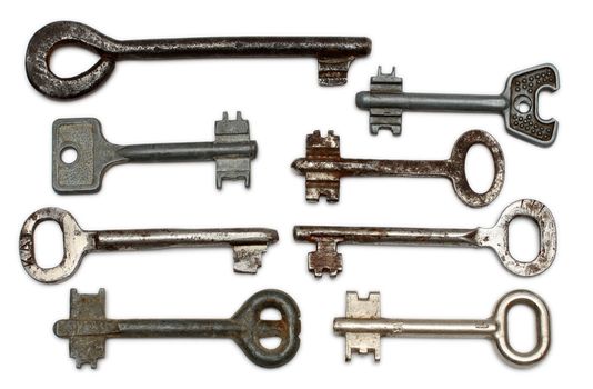 eight old rusty keys isolated on white