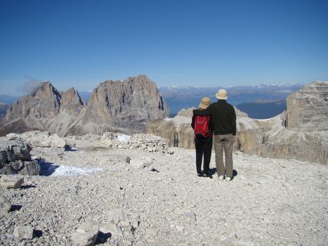 couple in Dolomite mountains admire alpine view Alps Dolomite Mountains Italy 2007