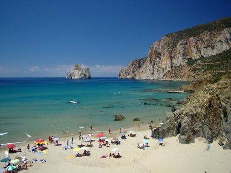 Beach Near Iglesias In Sardinia
West cost of Sardinia islandsouth to Costa Verde. In background famous small island with funny shape:Pan di Zucchero near Iglesias. VII 2008