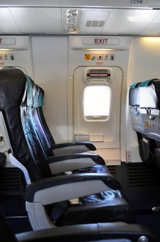 Emergency exit row. Passenger cabin of a commercial airliner