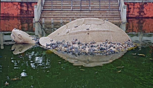 Turtle statue in the garden of Baolin Temple in Shunde China