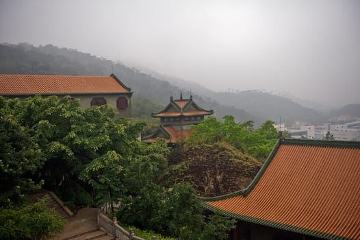 Multiple roofs poking out of the forest from the Baolin Temple in Shunde, Foshan,  Guangdong China