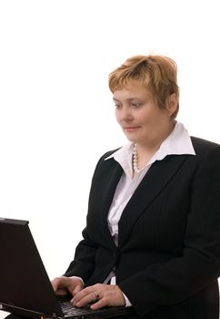 Mature businesswoman searching internet on her laptop computer