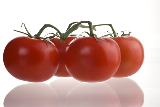 Healthy food image four fresh tomatos on the table