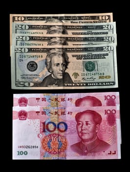USA and China paper currency on black background