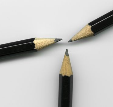 Extreme close up of three sharpened pencil tips