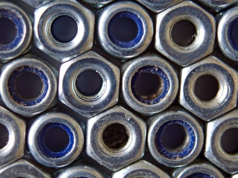 Close up photo of  nuts used in construction.