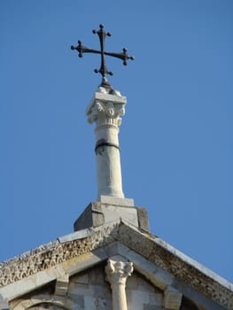 cross on the roof of th historical church