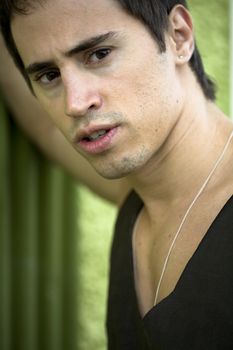 A young male model from Brazil in outdoors photograph.