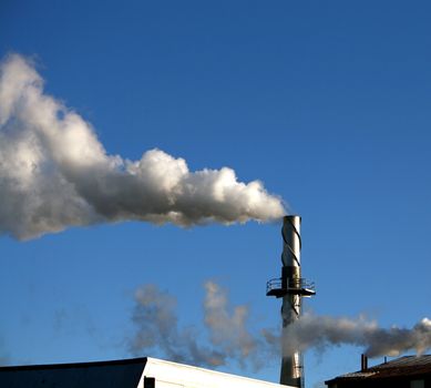 a single smokestack at a factory, showing a flume of smoke and air pollution
